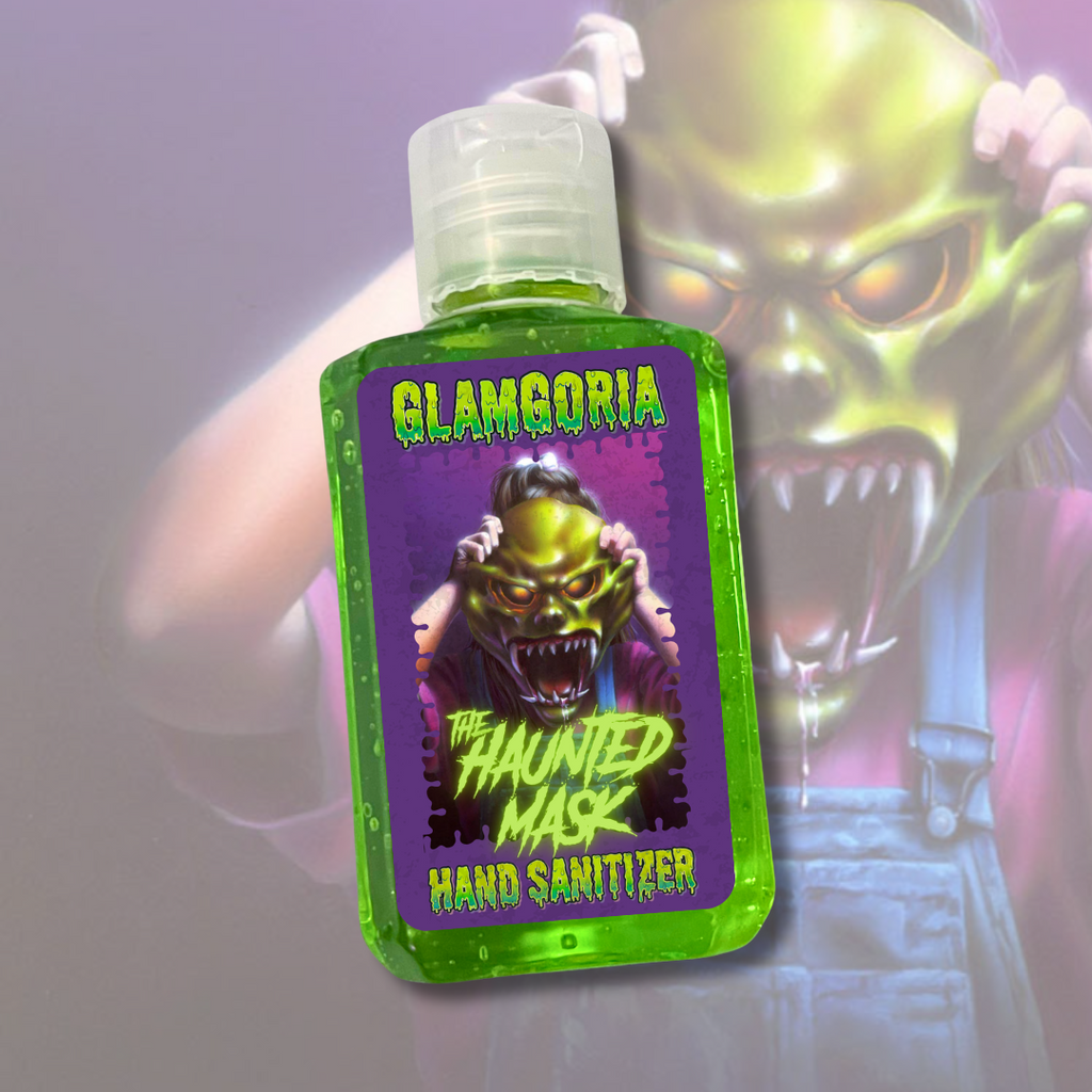 Green Glamgoria hand sanitizer labeled “The Haunted Mask,” showing a terrifying green monster mask being pulled on.