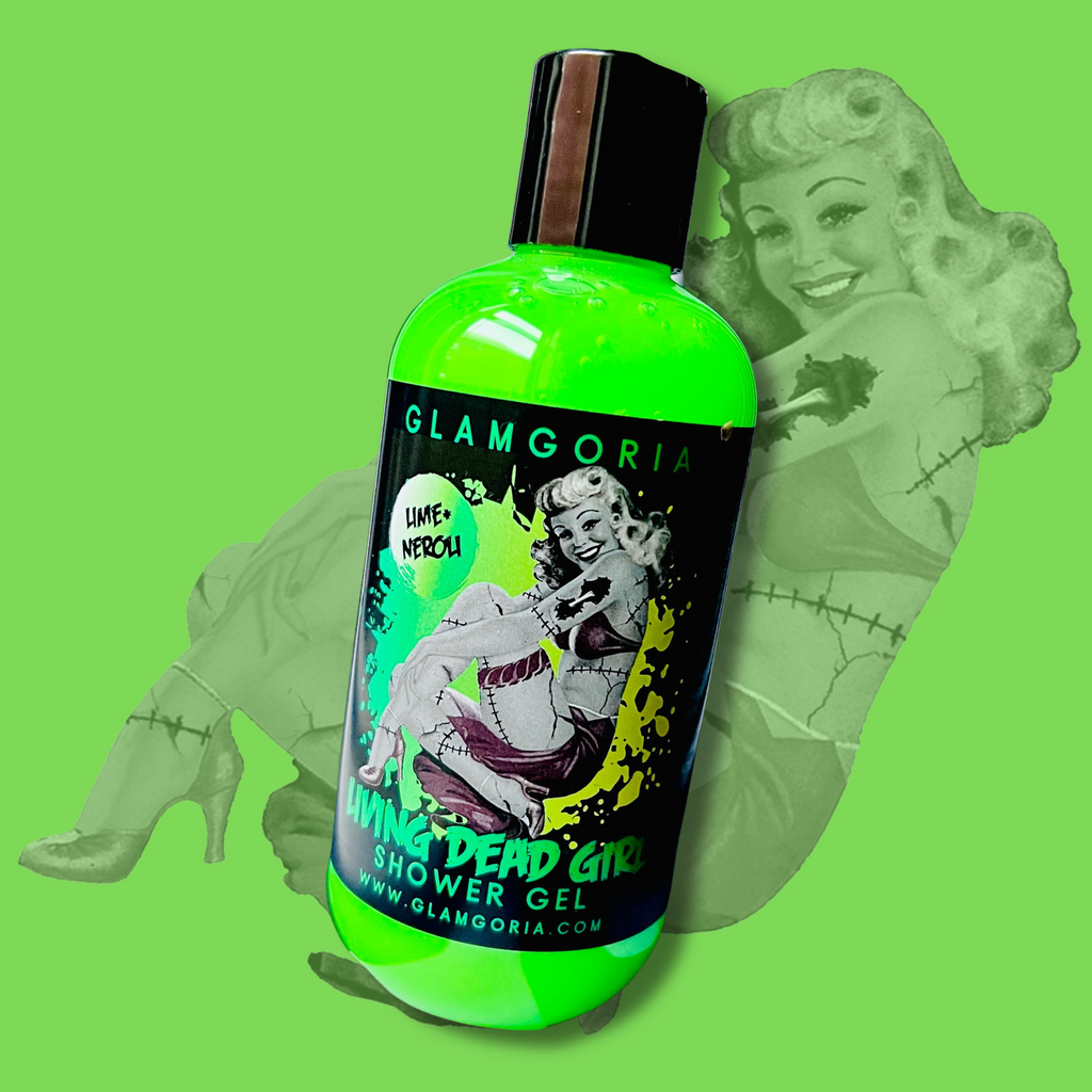 Living Dead Girl Shower Gel by Glamgoria, bright green with pin-up zombie girl label, set on spooky green backdrop