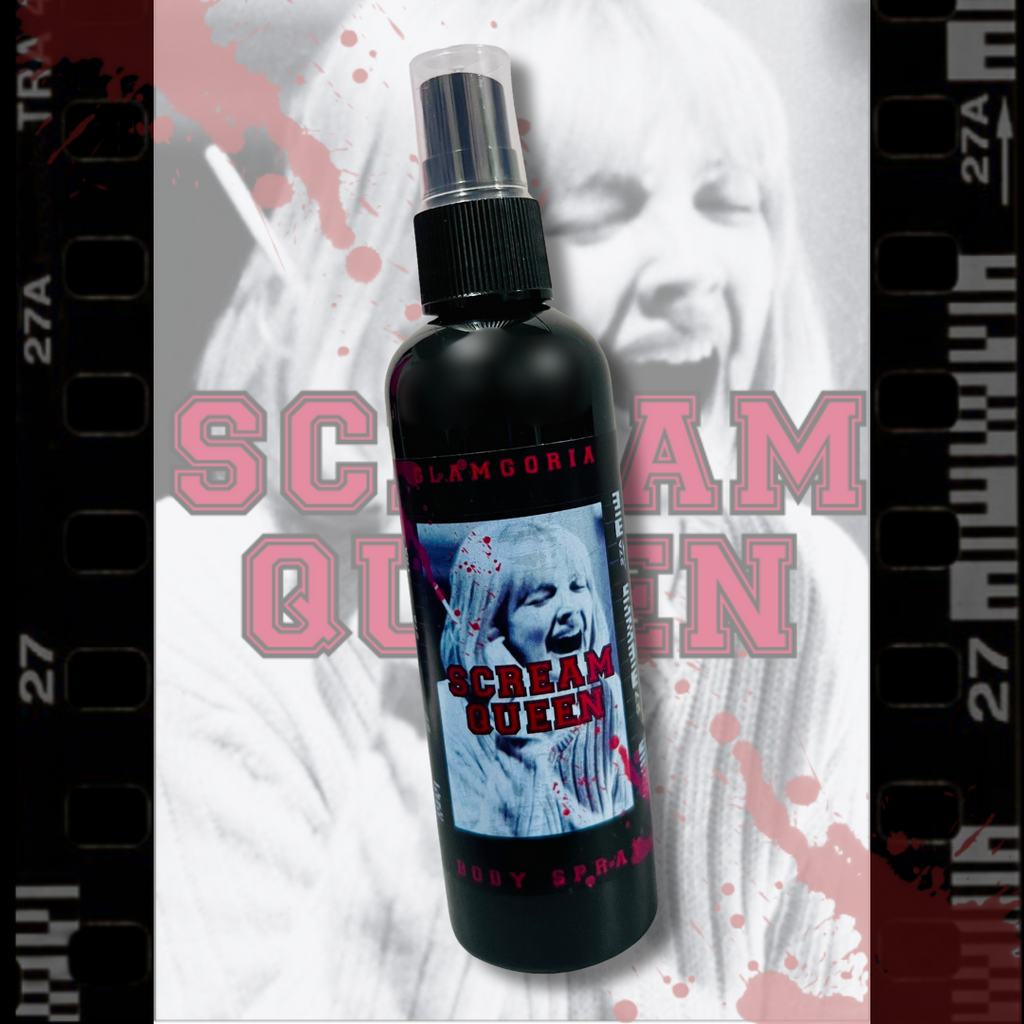 Black bottle of Glamgoria’s Scream Queen Body Spray with a retro horror label featuring a screaming woman, placed over a blood-splattered film strip background.