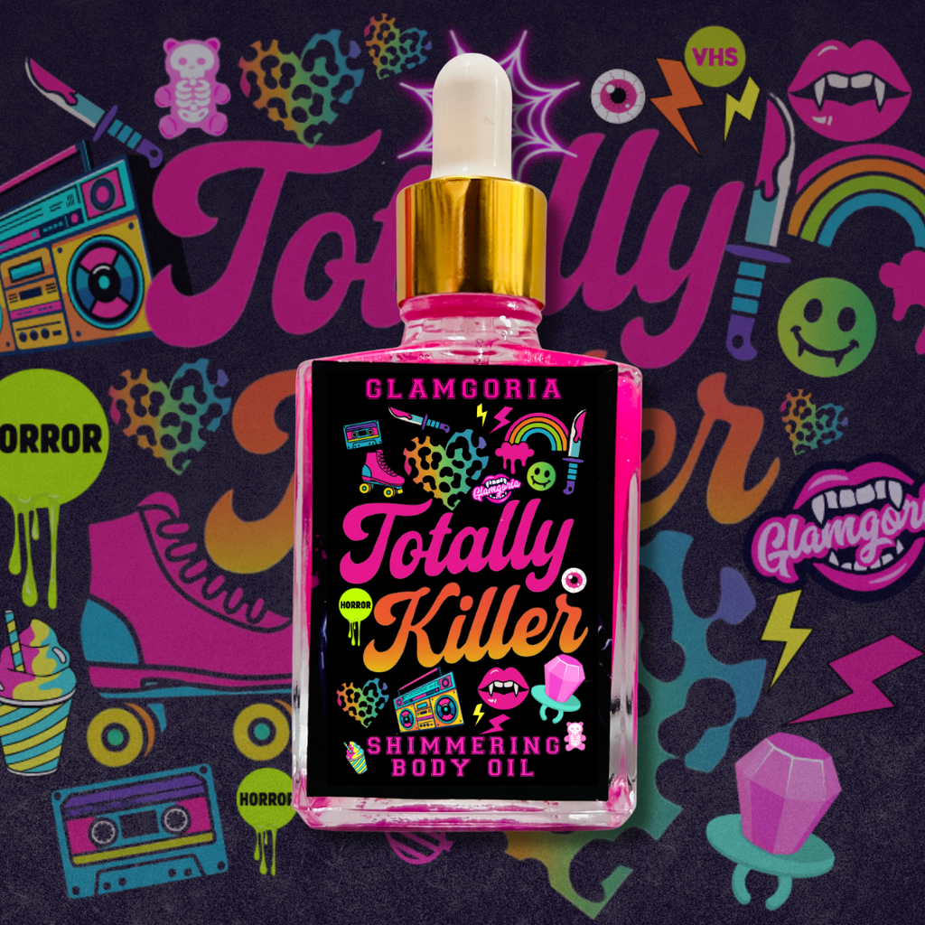 Glass dropper bottle of Glamgoria Totally Killer Shimmering Body Oil with bright pink oil and neon horror-inspired graphics. Fragrance includes peony, passion fruit, and blood orange.
