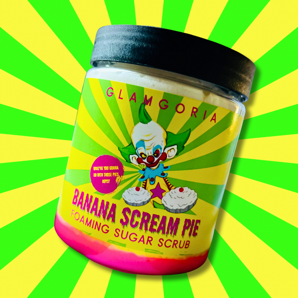Jar of Banana Scream Pie foaming sugar scrub with yellow whipped texture and Killer Klowns-style clown artwork.