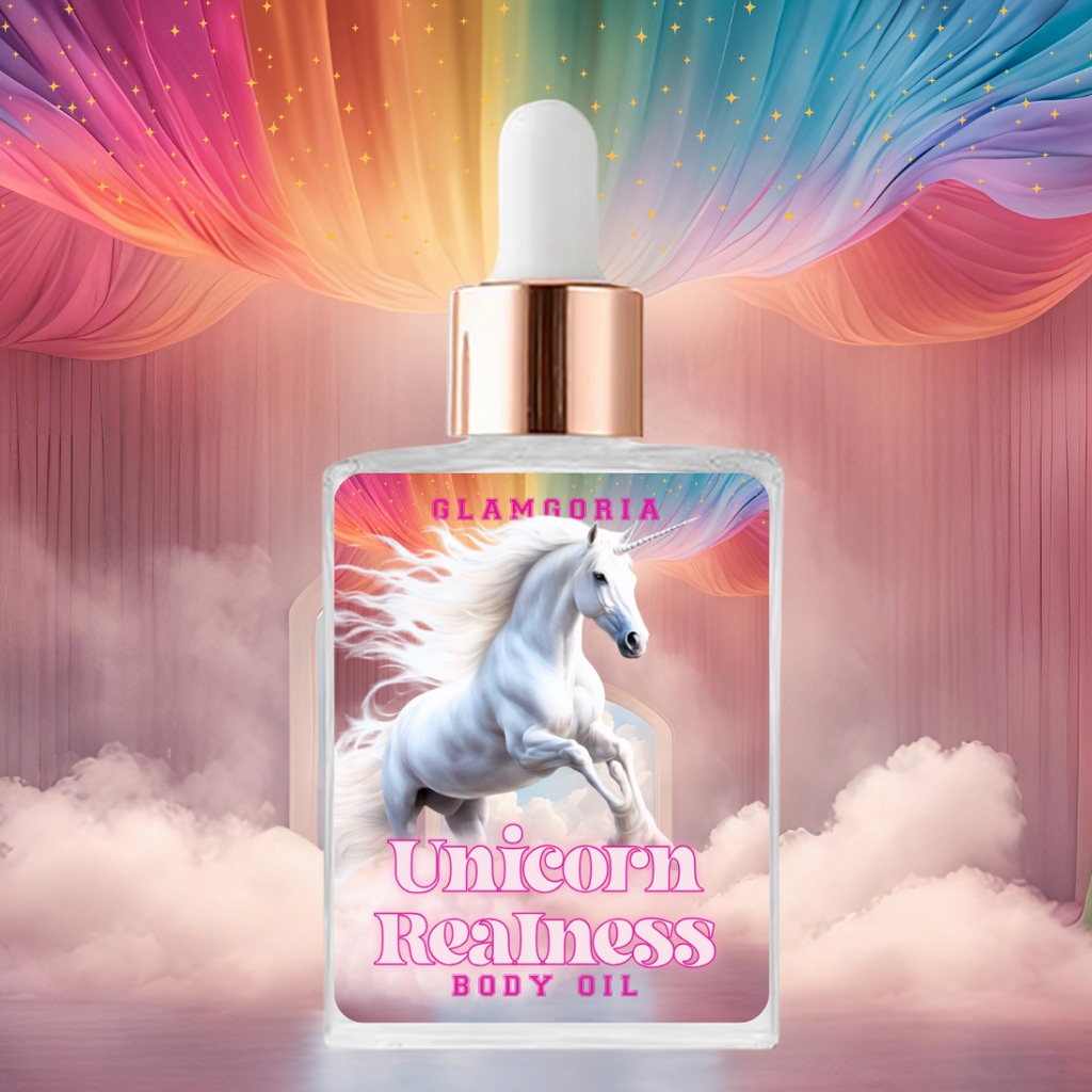 Square bottle of Glamgoria’s Unicorn Realness Shimmering Body Oil featuring a majestic white unicorn galloping through clouds under a rainbow draped sky. The label includes the product name in bold pink fantasy-style font, and the bottle has a white dropper top with a metallic rose gold collar. The background is dreamy with pink curtains, misty clouds, and rainbow-colored drapery with stars.