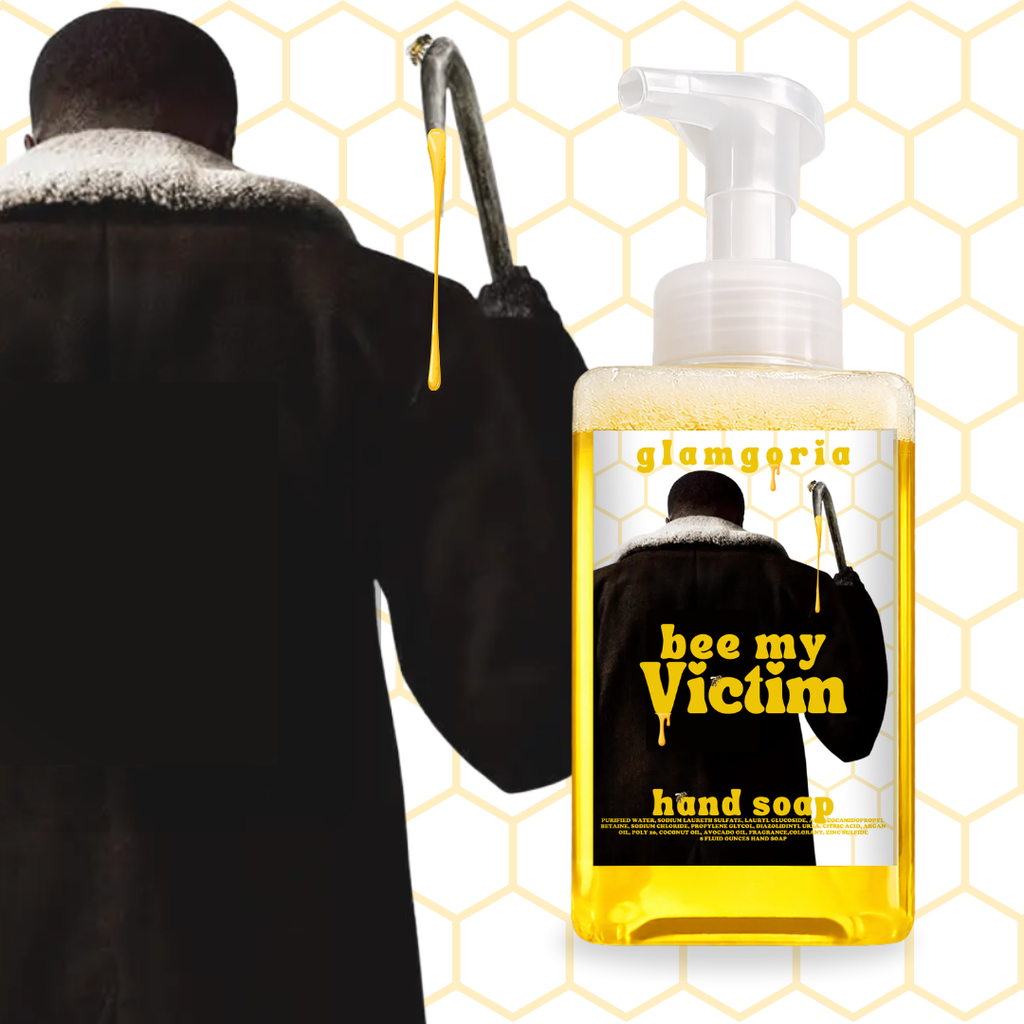 Foaming hand soap bottle filled with golden yellow soap labeled “Bee My Victim” with honeycomb background and horror-inspired artwork

