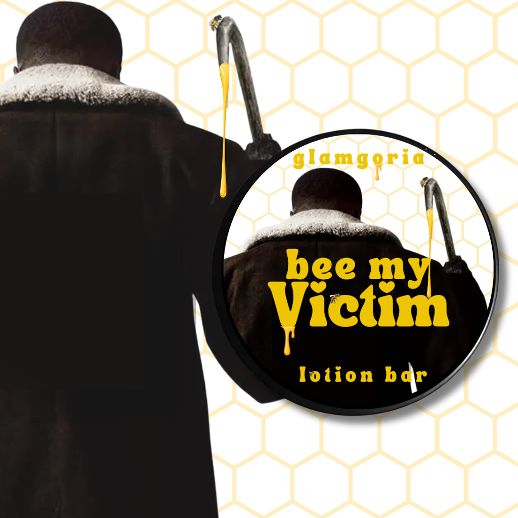 Round lotion bar tin labeled “Bee My Victim” with honey-drip design and dark romantic horror aesthetic