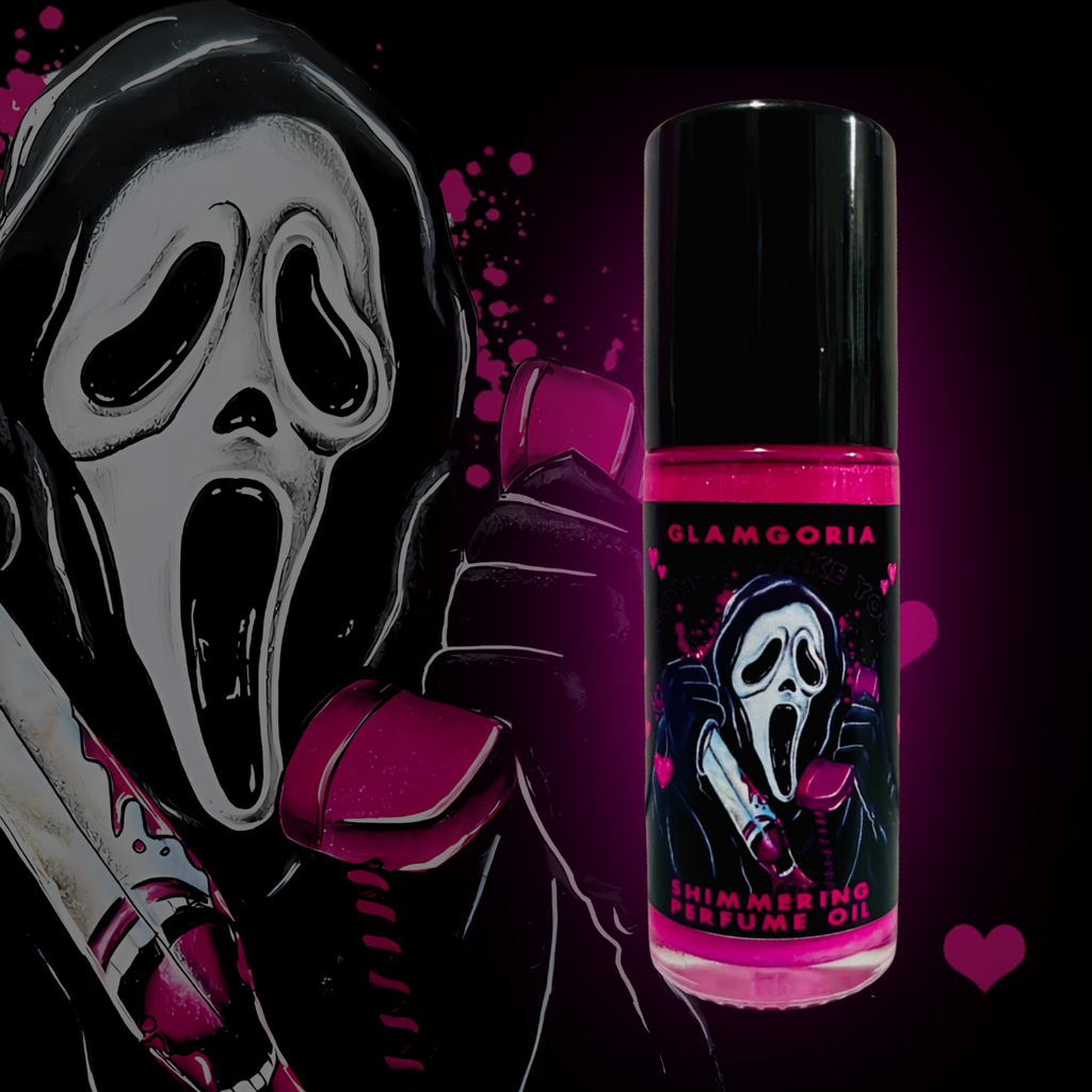 Roll-on perfume oil filled with pink shimmering liquid labeled “Gonna Make You Scream,” featuring a ghostface-inspired illustration.
