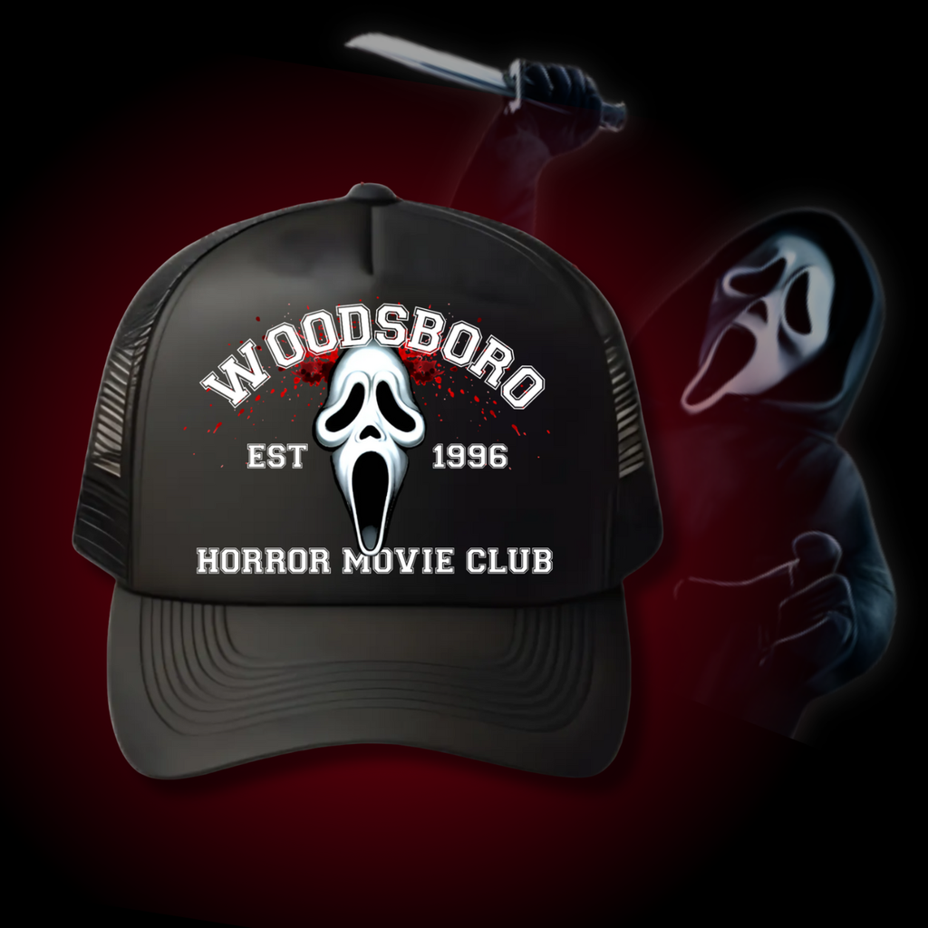 Black trucker hat with “Woodsboro Horror Movie Club EST 1996” text and a ghostface-inspired emblem on the front.