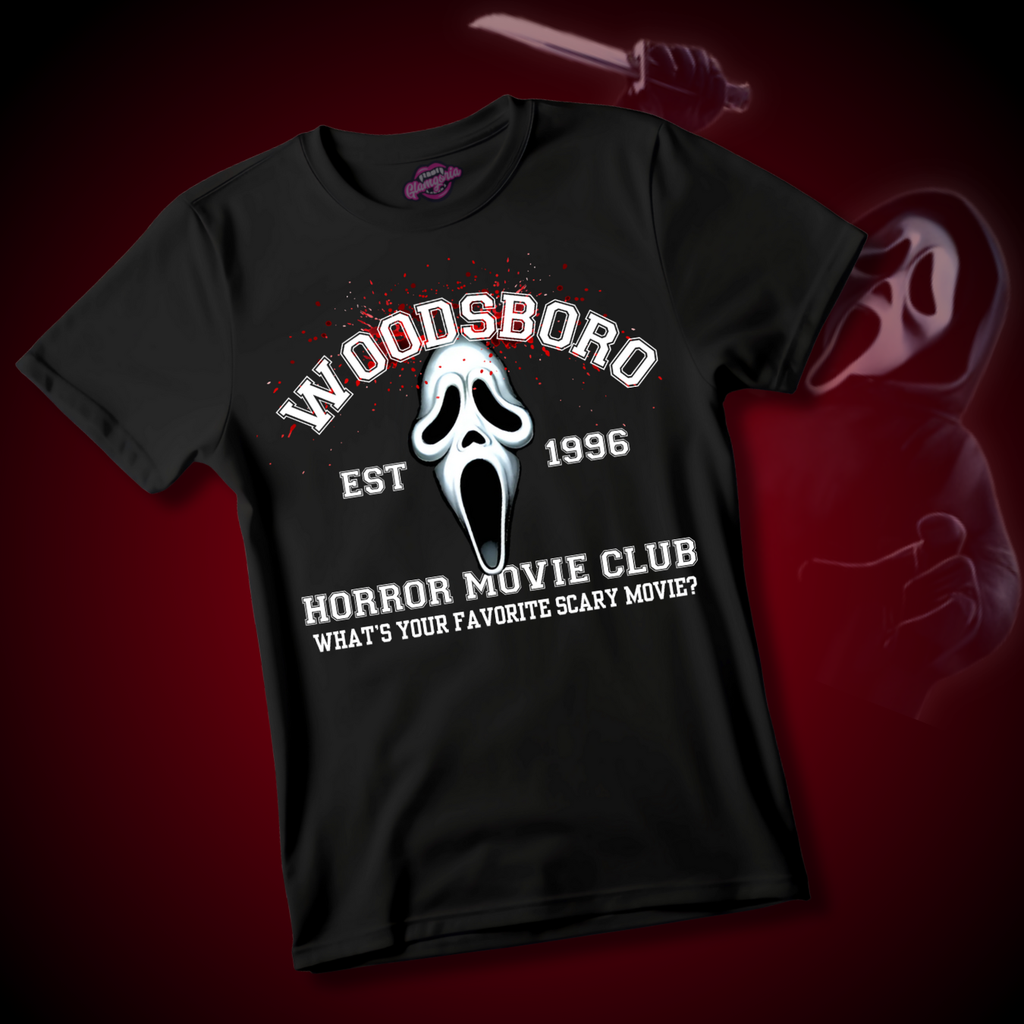 Black t-shirt with “Woodsboro Horror Movie Club EST 1996” text and ghostface-inspired graphic with red splatter accents.