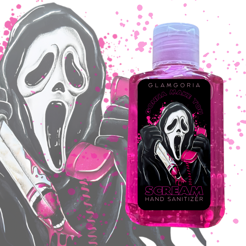 A bright pink strawberry-scented hand sanitizer bottle with artwork of Ghostface holding a bloody knife and a pink phone. The label reads “Glamgoria – Gonna Make You SCREAM Hand Sanitizer” in bold horror-style font. Background includes splashes of pink blood.