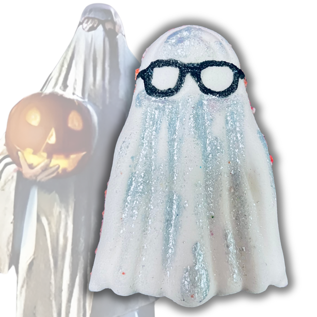 Ghost Bob bath bomb shaped like a sheet ghost with glasses, inspired by Bob’s costume from Halloween 1978, decorated with shimmer and sparkle.
