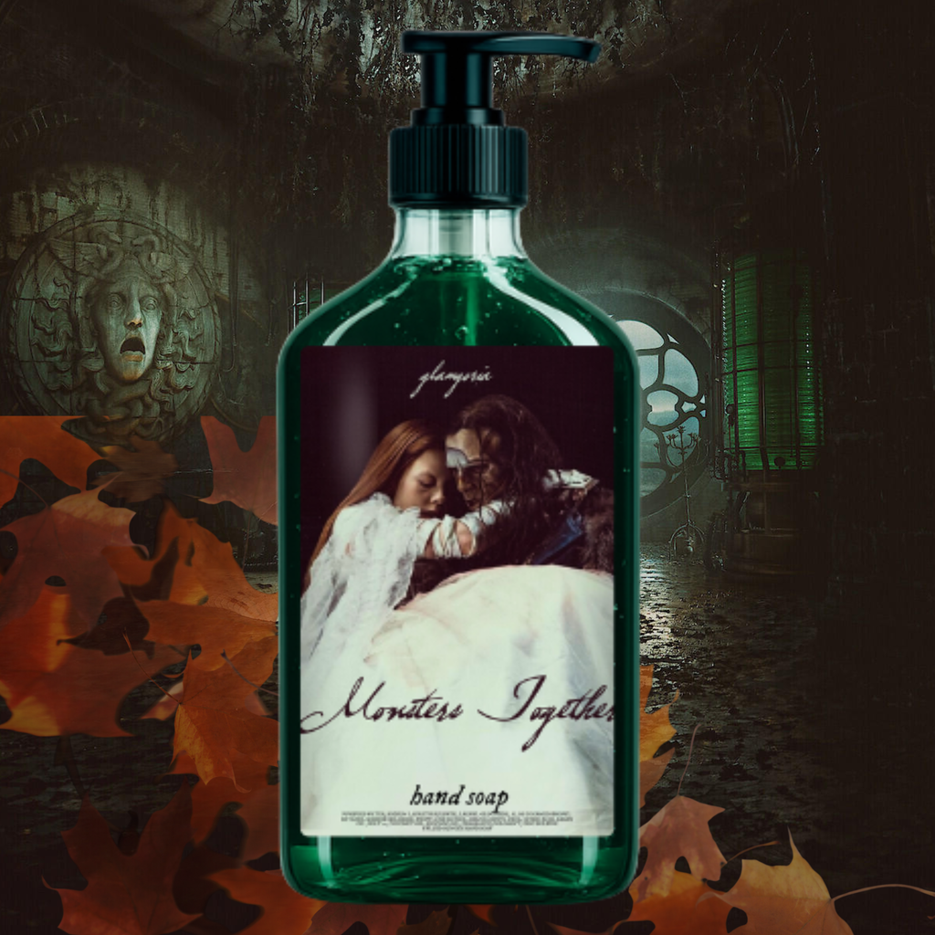 Dark emerald green hand soap in a clear pump bottle with a gothic label depicting the Creature and Elizabeth embracing, set against a moody, haunted interior background inspired by Frankenstein.
