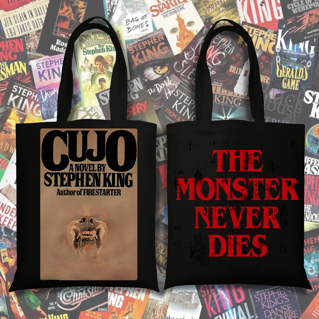 Black tote featuring Cujo inspired book cover artwork and the phrase “The Monster Never Dies” in distressed red lettering.
