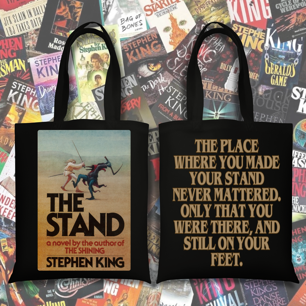 Black tote bag with The Stand inspired cover art on one side and a quote about survival and resilience on the other.
