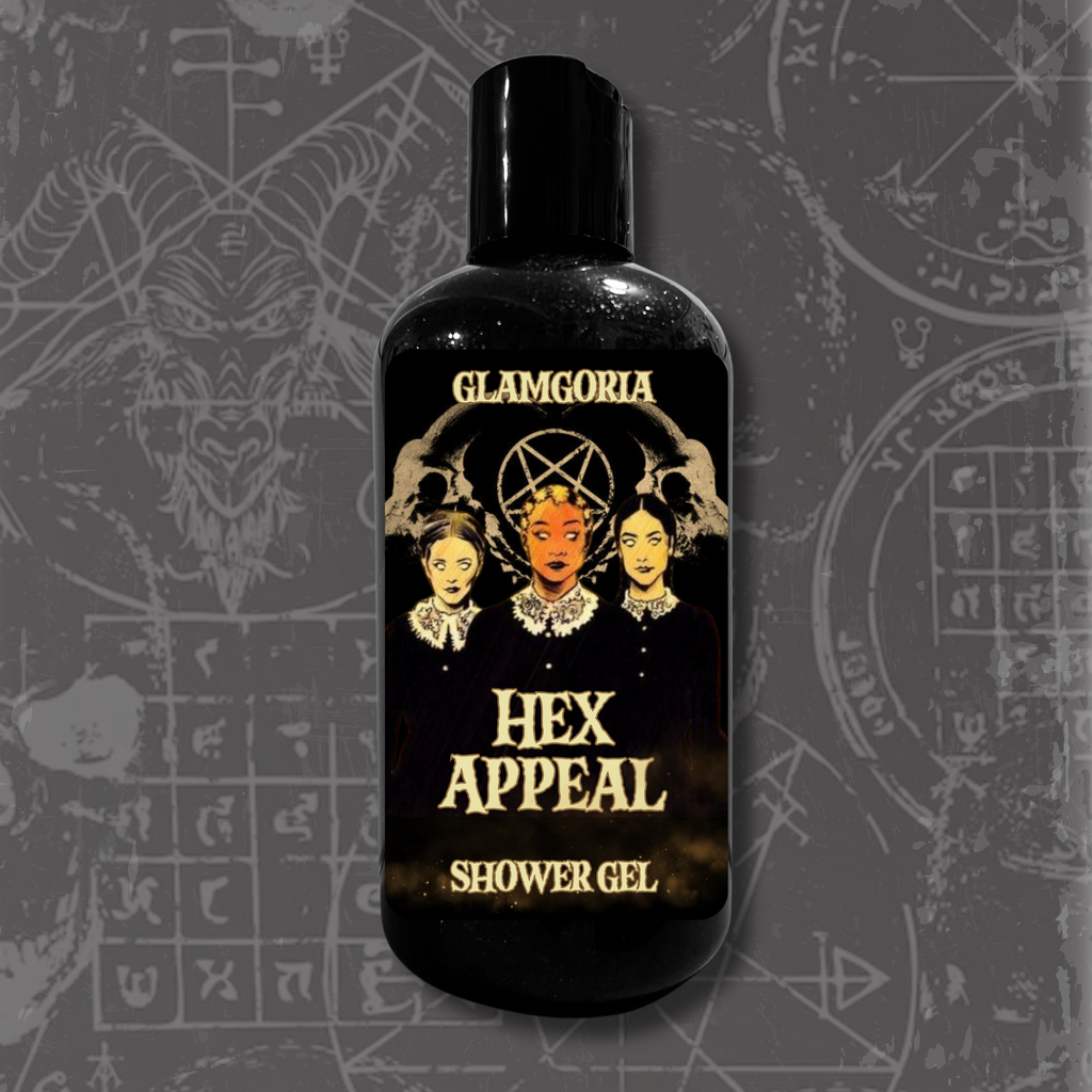 A black capped bottle labeled Hex Appeal Shower Gel by Glamgoria, decorated with the Weird Sisters-inspired trio and ritual imagery.