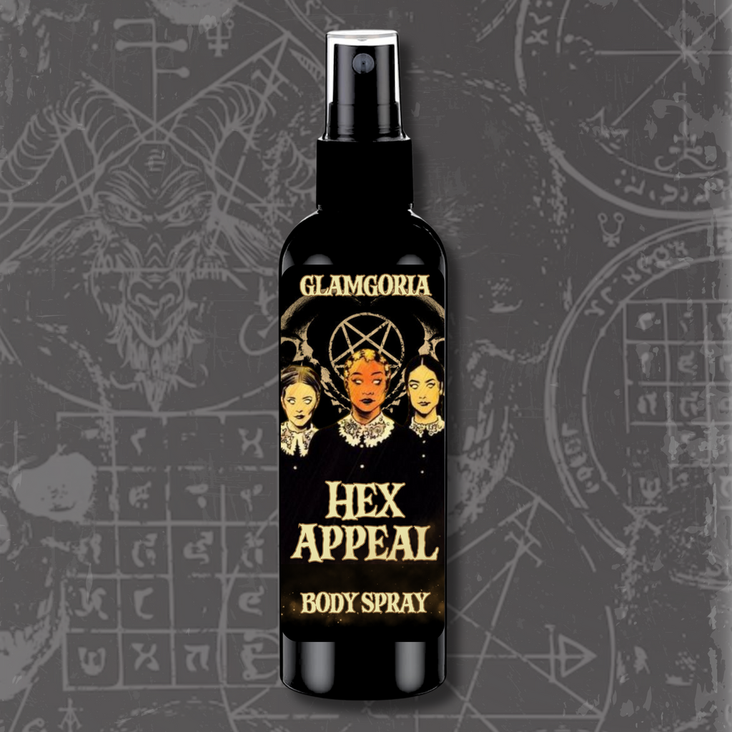 A sleek black spray bottle labeled Hex Appeal Body Spray by Glamgoria. The design features the Weird Sisters-inspired artwork with occult motifs.