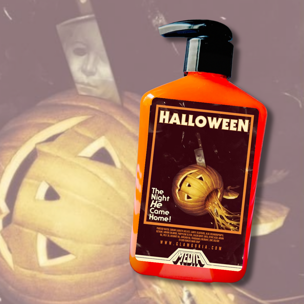 A horror-themed hand soap inspired by the 1978 film Halloween, featuring a bright orange bottle and a vintage-style label with the iconic jack-o’-lantern and knife poster art. The label includes the tagline “The Night He Came Home!” with a VHS-style aesthetic and the Glamgoria logo. Perfect spooky décor for horror fans and collectors